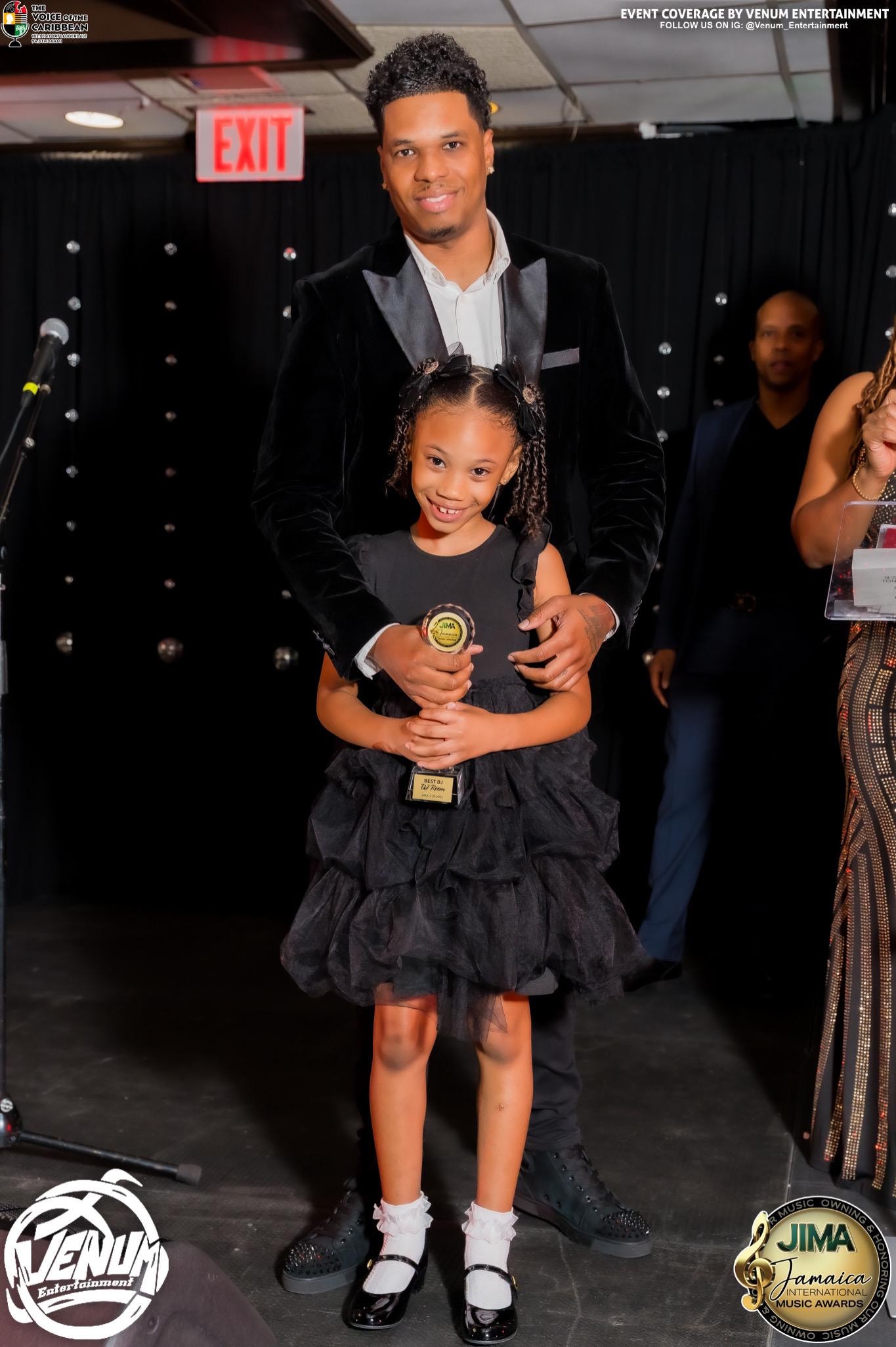 DJ Reem receiving Best DJ in South Florida award at JIMA alongside his daughter Kalani Ariana